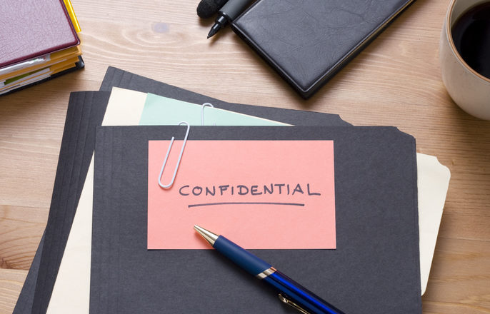 File folder with confidential written on it